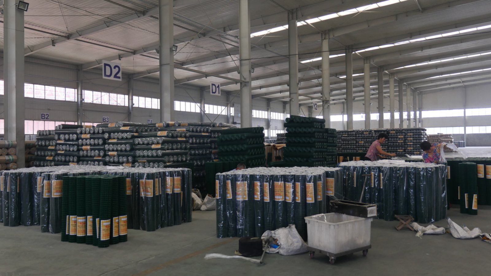 Factory aisle with large wire mesh inventory