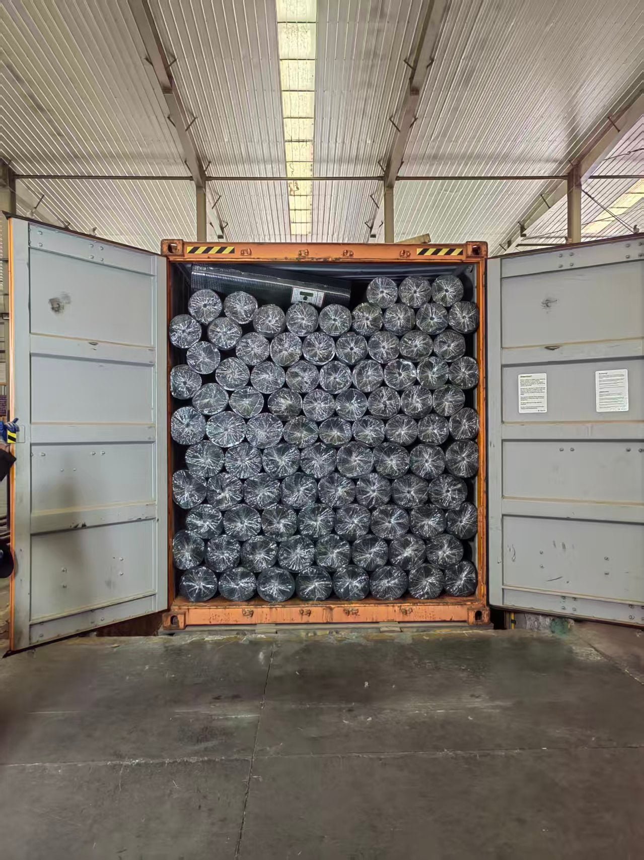 Packed wire mesh bundles ready for container loading